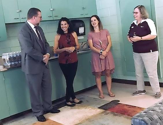 Left to right: Dr. Kenneth Greene (superintendent), Theresa Hough (guidance counselor) and Karen Thibault (social worker) discuss the opening of The Green Room with Karen Mazur (coordinator of guidance and the woman responsible for seeing this project through).