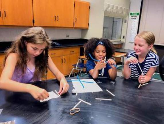 Campers work as a team to engineer their own sculptures