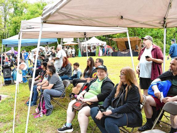 New generation of knights Festival attendees watch the sword-fighting.