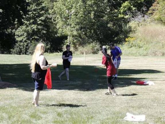 Pokemon water balloon fight on SCCC campus PHOTOS BY LAURIE GORDON Candice Christiano, left, oversees a Pokemon Go Water Baloon Fight at Sussex County Community College.