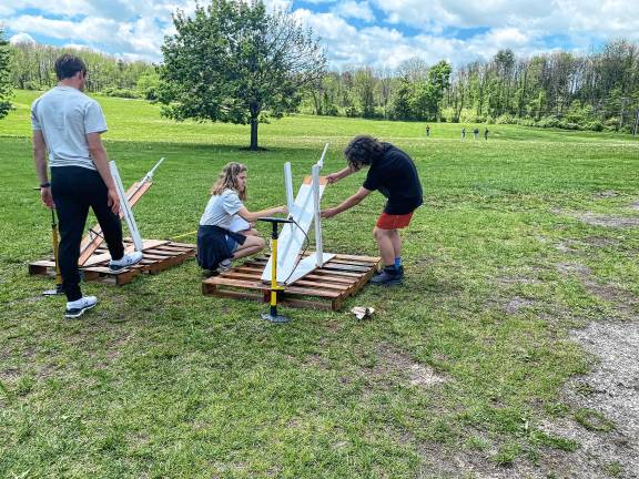 Students build water rockets Hardyston Middle School competitors and high school assistants, from left, Noah DeRenzo, Emily Guarino and Jovanni Portilla prepare their launcher for final testing during the annual STEM League Challenge on May 7. (Photos by Juleanna Green)
