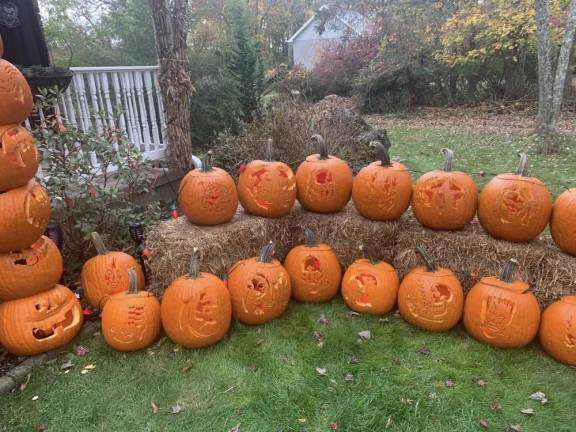 Their extended family and friends carve pumpkins displayed at the Stillwater home of Mike Young and Sara Bartlett. (Photo provided)