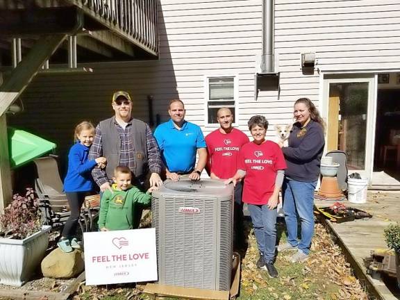 The Korver family will have warm winters and cool summers as a part of 'Feel the Love' by R. Poust Heating &amp; Cooling, Inc., with Lennox.