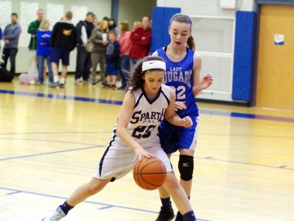 Sparta's Olivia Romano dribbles the ball while covered by Kittatinny's Madison Beyer.