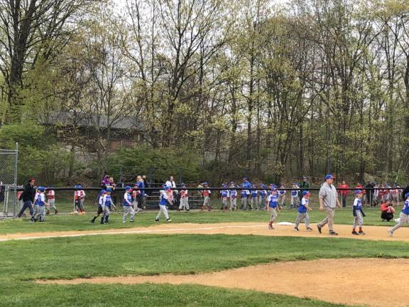 Lakeland Little League teams march on to the field on opening day Saturday, April 22 in Stanhope.