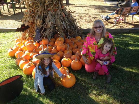 Nurse practitioner passionate in promoting mental health Drumm at Fall Fest with her granddaughters Ashlan Marie (left) and Sloane Louise (right).