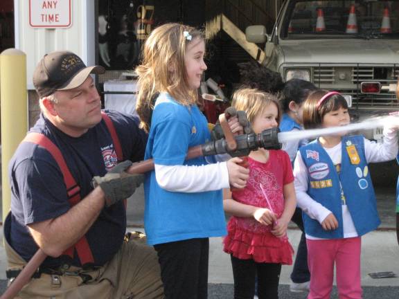 Fredons bravest help local Scouts Photo Provided Members of Girl Scout Troop 5624 operate the fire house with the help of a Fredon fire fighter.