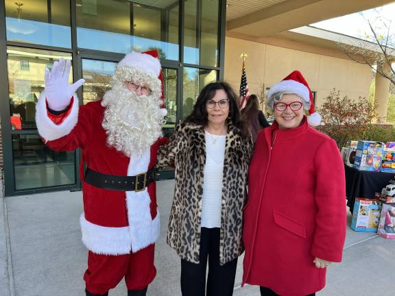 Season of Hope toy drive launches <b>Santa Claus, Sylvia Petillo and Mrs. Claus are shown at the Season of Hope Toy Drive.</b>