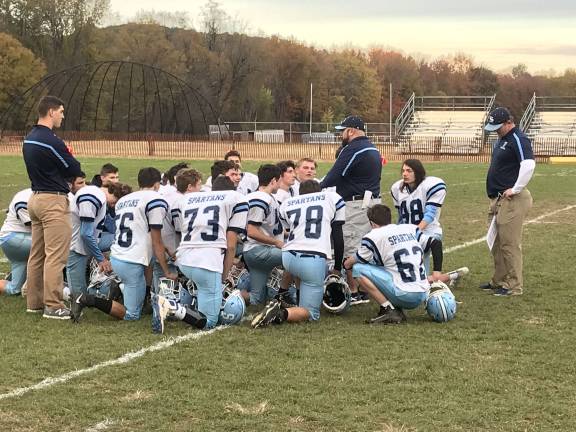 Sparta High School freshmen huddle after the final game of the season, undefeated, and not scored upon during the entire season. (Photo provided).