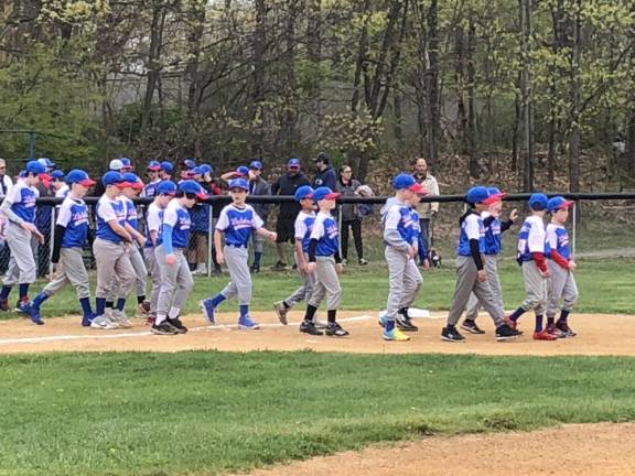 Lakeland Little League teams march on to the field on opening day Saturday, April 22 in Stanhope.