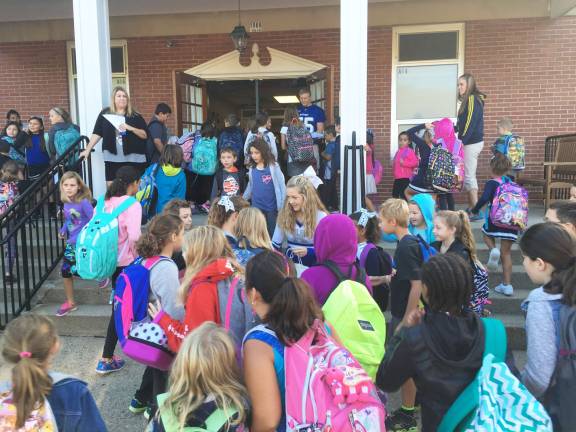KRHS teams visit elementary schools Cheerleaders and football players greet students coming into school on Friday at the Stillwater Elementary School.