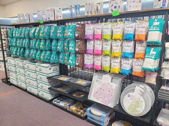 A colorful array of chocolate wafers and a variety of baking pans are a few of the items available at Sugar Sister (Photo by Mandy Coriston)