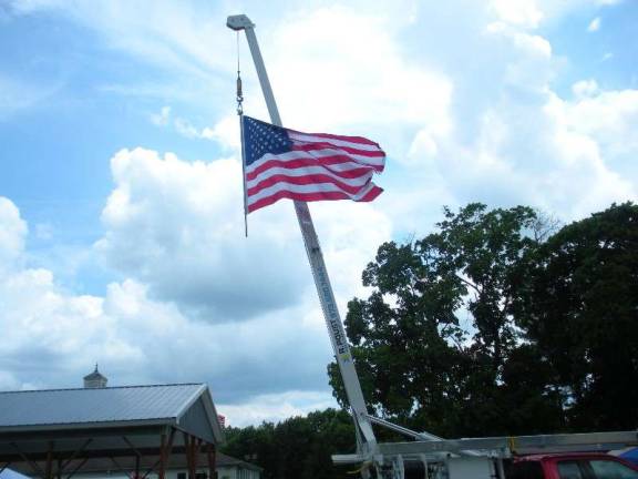 Music, fireworks and fun at Andover Township Day A large American flag was hoisted on a utility truck from R. Poust Heating and Cooling