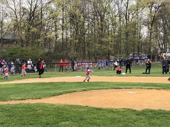 Lakeland Little League teams march on to the field on opening day Saturday, April 22 in Stanhope.