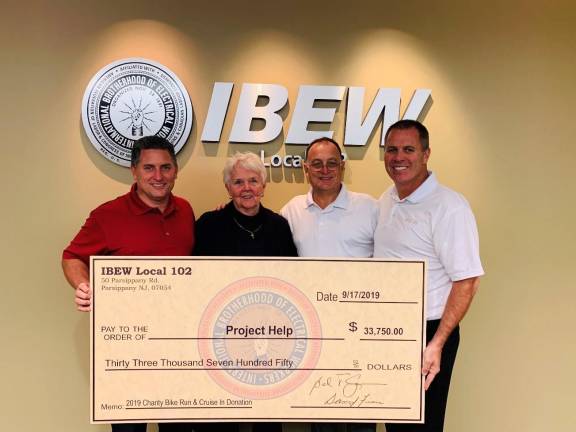 IBEW Local 102 Bike Run and Car Show to benefit veterans L-R: IBEW Local 102 Treasurer Dave Fiore, Project Help Executive Director Sandy Mitchell, IBEW Local 102 Business Representative Mike Scotto, and IBEW Local 102 President Bernie Corrigan.