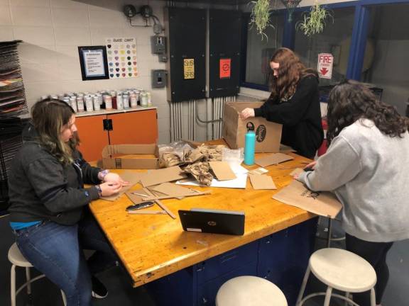 Eva Tomesheski, Sopia Nadaeu, Ella Gomez hard at work on their project.