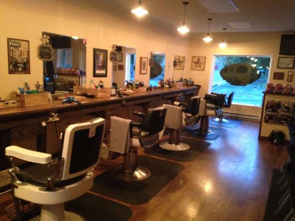 Cutting and grooming for decades John's Barbrr Shop, now on Lower Spring Street, Newton