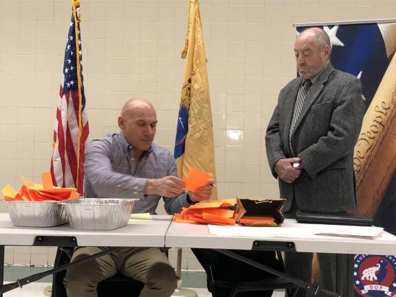 Eugene Wronko, secretary of the Sussex County Republican Committee, counts the votes.