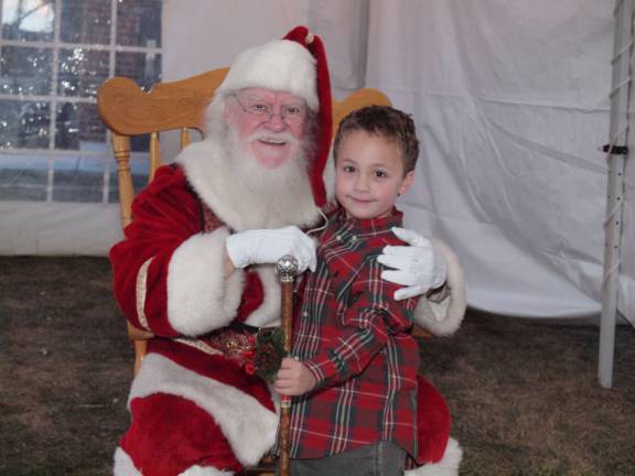 Santa strikes a pose with six year old Ryan Tango of Newton, N.J. The 22nd Annual C. Edward McCracken Festival of Lights took place in Newton, New Jersey on Saturday, November 16, 2013. Newton Medical Center was the location of the event.