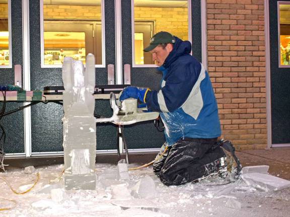 Cutting the ice Sussex County Technical School Culinary arts instructor Chad Gasiorek, of Shohola, Pa., gets busy ice carving with a chainsaw 6:30 a.m. Thursday outside of the school.