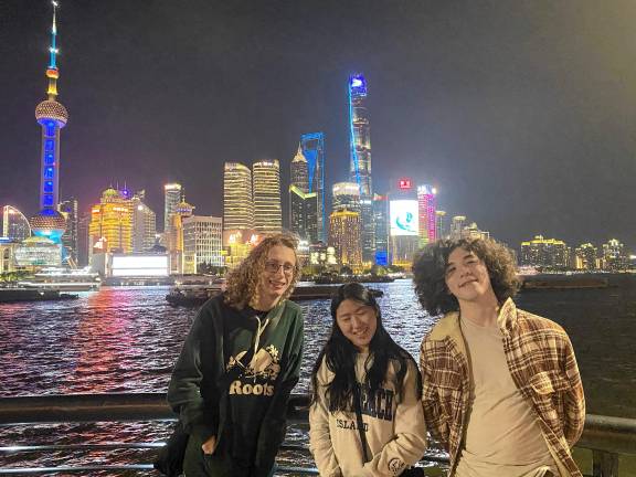 Students, teachers visit China From left, Grayson Petrie, Gianna Baron and Brett Meyer in front of the Shanghai Pudong skyline.