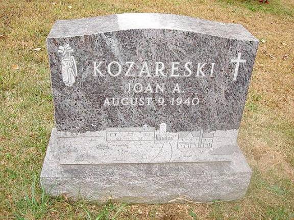 The resting place of property owner Joan Kozareski, showing the etching on her headstone depicting an exact replica of Overlook Farm, where she was raised and lived until her death in 2018.