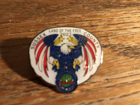 Veterans honored with parade, ceremony The veterans pin designed by Nicolas Pacheco.