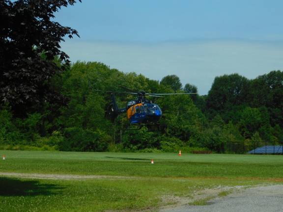 Atlantic Air Three visits children in 'Safety Town' at Long Pond School Atlantic Health’s Atlantic Air Three air ambulance lands on the field behind the Long Pond School in Andover Township on Tuesday, July 16, 2019 as part of the Safety Town program for the district’s incoming kindergartners. (Photos by Mandy Coriston)