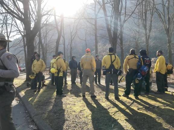Rain helps extinguish last of Delaware Water Gap fire Wildland firefighters gather at Kittatinny Point for a morning briefing before heading up Mount Tammany.