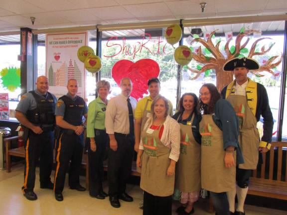 Dignitaries help ShopRite fight hunger Shown, from left, are: Officer Rafael Burgos, Officer Jeffrey Korger, Cherie Hudson (Customer Service Manager), John DeCarlo (General Store Manager), Jake Checkur, Assemblywoman Alison McHose, Lisa Darcy, Jennifer Campbell, and Paul Checkur as George Washington at Franklin ShopRite.