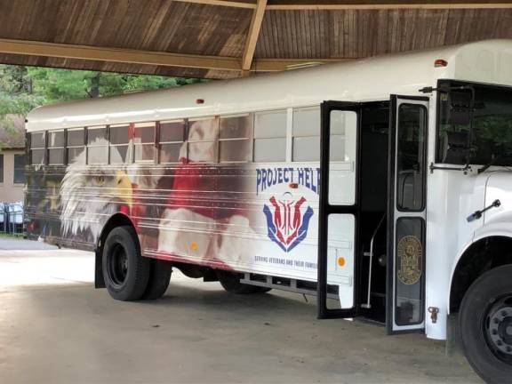 The theme of this year's poster contest is the Project Help bus, which provides aid to veterans.