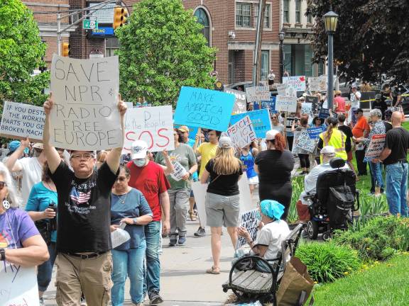 Photos: May Day protest in Newton About 200 protesters gather Saturday, May 3 at the Newton Green. It was one of about 18 demonstrations in the state organized by NJ50501 to protest policies of President Trump. (Photos courtesy of Ray Mueller)