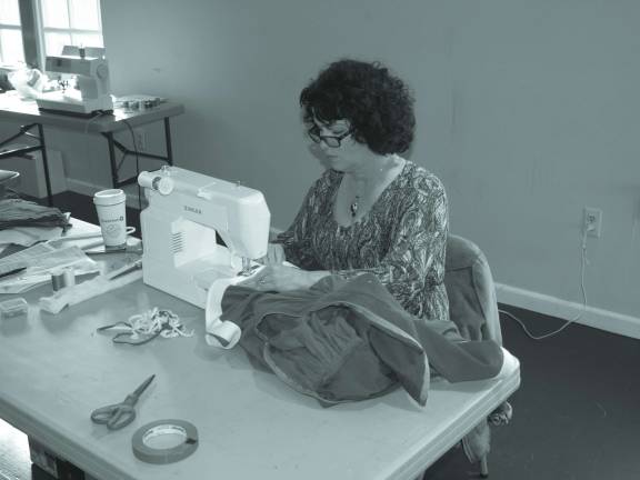 Locals star in Rudolph Sue Brizek of Sparta busy in the costume department.