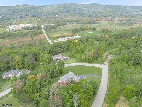 Enjoy mountain views from this light-filled colonial-style home