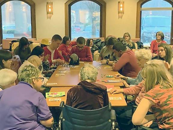 Mrs. Carter's students and Bristol Glen residents play games during a visit in 2019 (Photo provided)