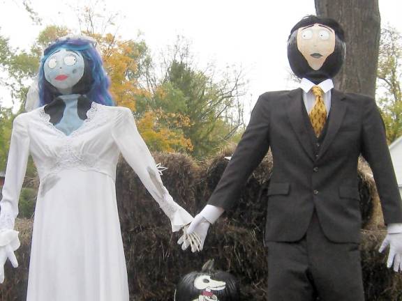 These dashing pumpkin heads await your visit Woods Funeral Home joins in the fun with their pumpkin head bride and groom (Photo by Janet Redyke)