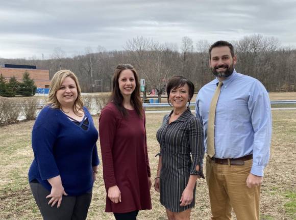 From left to right: Education award winners Lauren Taylor, Ryan Resch, Dina Michaud and James Clayton.