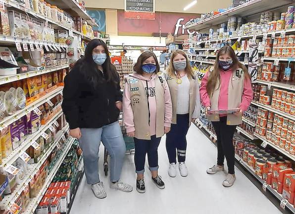 Wallkill Valley Girl Scouts donate Thanksgiving dinners to food pantry Wallkill Valley Girl Scouts shop at Weis Market for families in need (Photo provided)