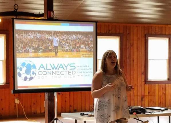 Organizer Nicole Pacich speaks to the crowd at the Barn at Hillside Park