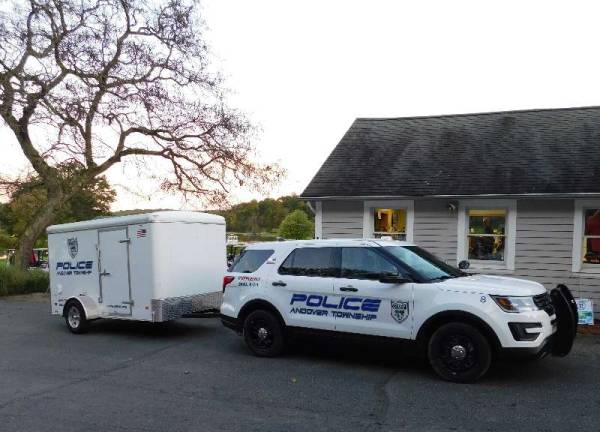 Andover police step up to run Bosworth Memorial golf outing Phots by Mandy Coriston A police cruIser and trailer are parked outside the country club’s pro club.