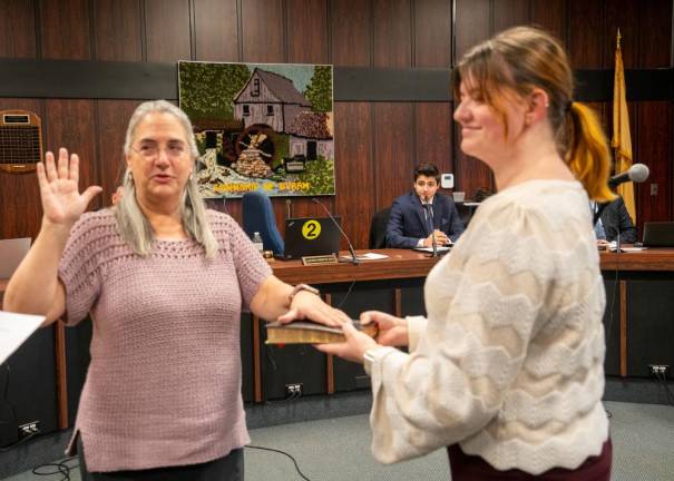 BY2 Councilwoman Lisa ‘Cris’ Franco takes the oath for a new term. Holding the Bible is Rebecca Franco.