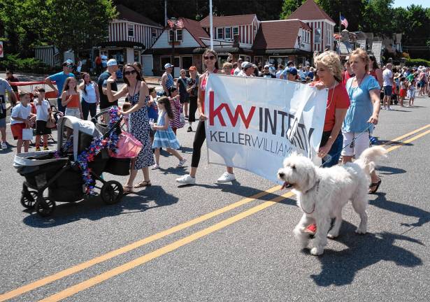 Sparta. Fourth of July events Employees of the Keller Williams real estate firm march in the parade.