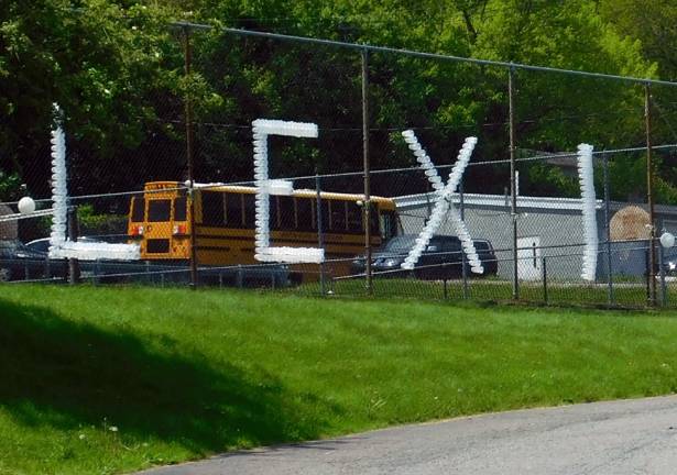 At the High School, letters spell out &#x2018;Lexi&#x2019; on a fence this week, to pay tribute to junior Alexis &quot;Lexi&quot; Faye. photo by Mandy Coriston