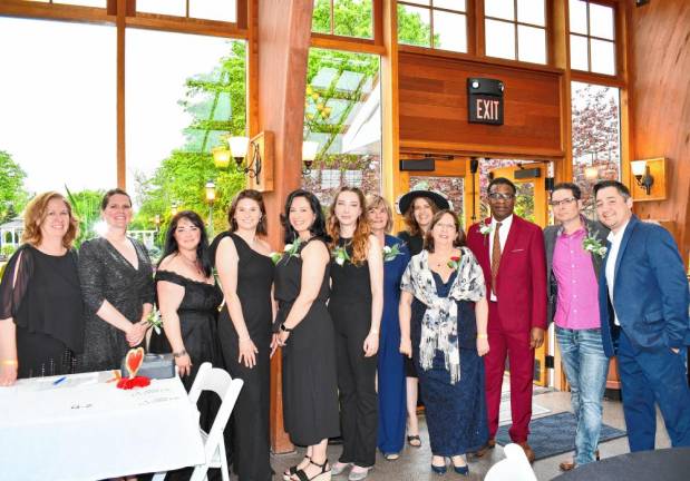 Family Promise Casino Night <b>Family Promise staff and volunteers pose at the Casino Night fundraiser. Fourth from right is executive director Chris Butto.</b>