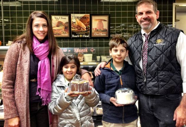 Hayek’s celebrates expansion The Hayek Family: Denise, Dan, Julie and Josh, in the new bakery section.