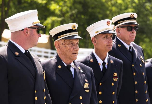 Members of the Byram Township Fire Department wait for the start of the parade. The fire department is 75 years old.