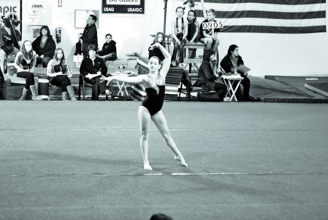 Sister gyms compete Gator Bowl brings out the best in gymnastic competitors Photo provided Lia McAuliffe of Branchville performs her floor routine.