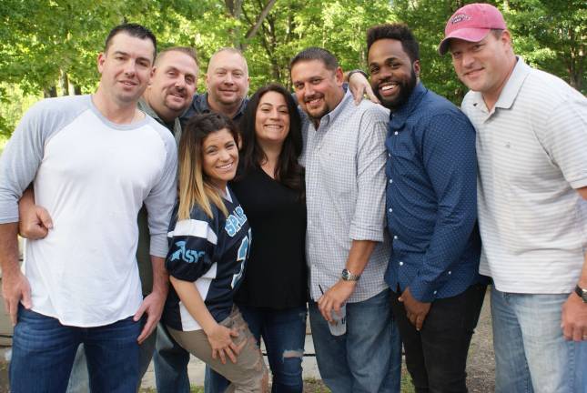 Reunification party for Sparta youth football Key players in the league's reunification. From left, League Treasurer Chris Purdue, Head Coach Ross Richardson, Advisethe Nerdsr Josh Hertzberg, Co-Director of Cheer Judy Zimmerman, Director of Cheer Katherine Leo, President Tim Lindsay, Player Advocate ‘Coach V,’ and Director of Fields Mark Pryce. Those not pictured include: Vice President Doug Brancey, Secretary Karen Killen, League Representative Lou Tackis, Head Team Mom Natalie Tackis, Assistant Team Mom Kristine Szabo, Assistant Team Mom Karina Hein and Player Advocate Chris Hantson.