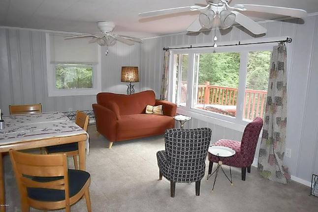 Two-bedroom ranch offers easy lakefront living Living room