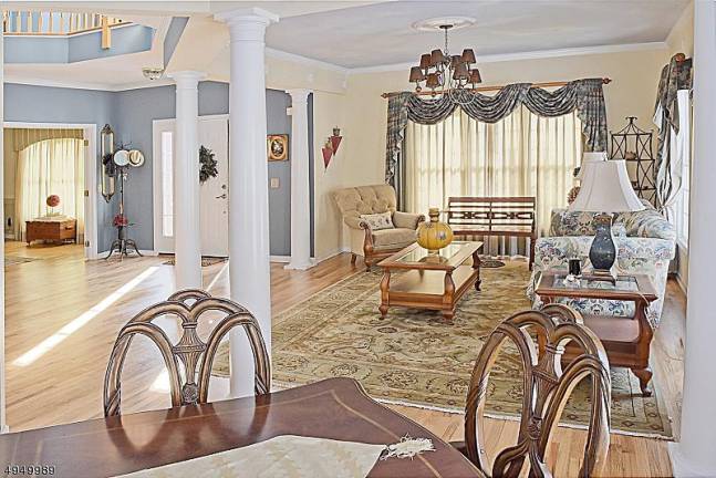 Stately brick-front colonial at Woodcrest Lake offers privacy Stately brick-front colonial at Woodcrest Lake offers privacy